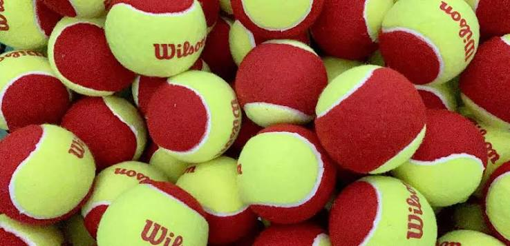 Red low-compression tennis balls for beginners